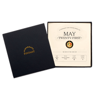 The May Twenty-First Pendant inside its box